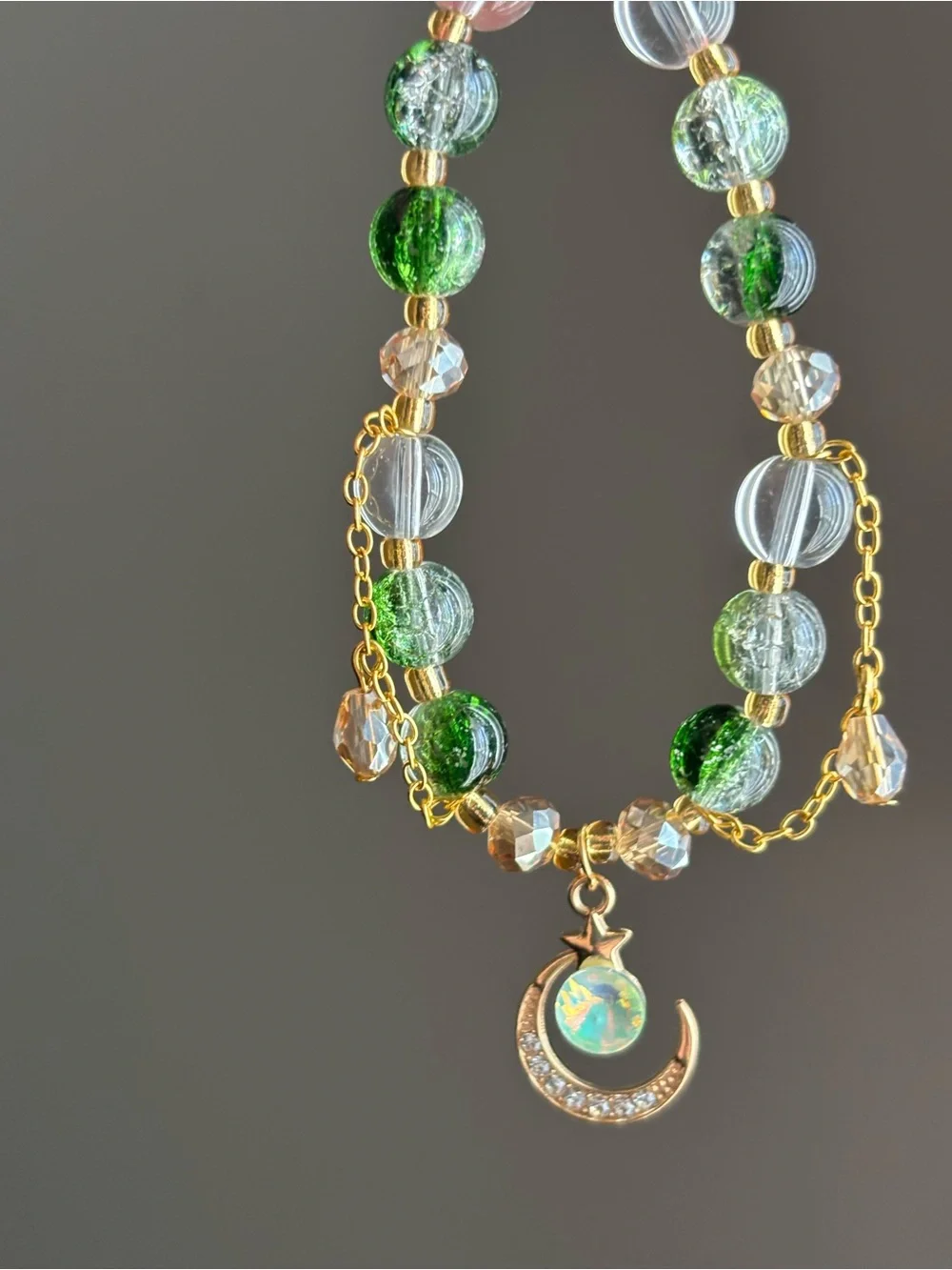Hand Crafted Gold-tone Green and Clear Beaded Moon Pendant stretch bracelet - Picture 2 of 3